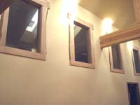 Glass in the four high windows overlooking the great room
